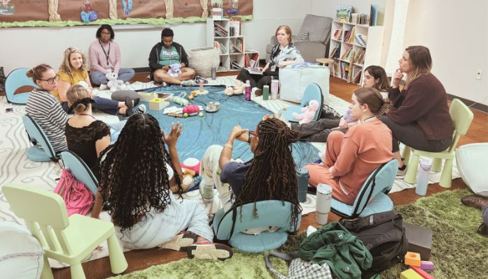 Teaching artists sitting in training session